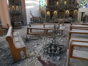 A fallen chandelier lies on debris in Im Al-Zinar church that was damaged during clashes between Syrian Rebels and the Syrian Regime in Bustan al Diwan, Homs