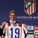 Spain forward Torres poses with his new jersey during his presentation ceremony at Vicente Calderon stadium in Madrid